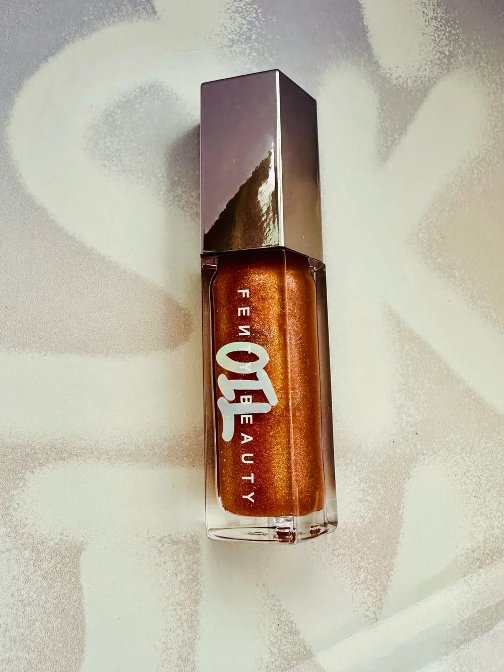 Fenty Beauty Gloss Bomb Lip Gloss in Frosted Bunz Sparkling Amber Gold